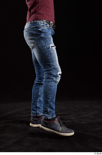Tomas Salek 1 blue jeans dressed flexing grey shoes leg…